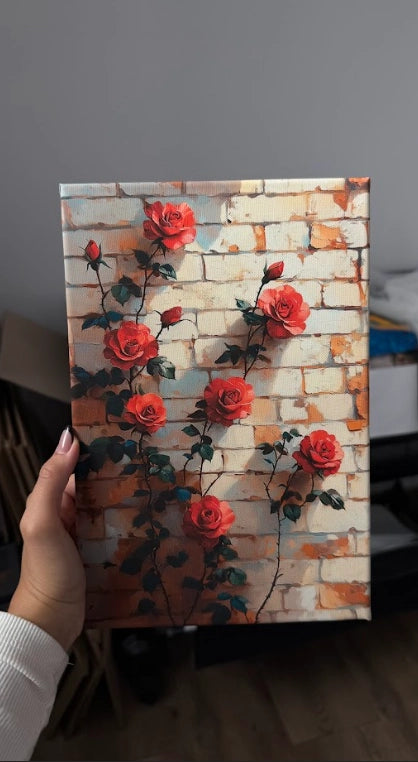 Obraz na płótnie — czerwone róże na tle cegły